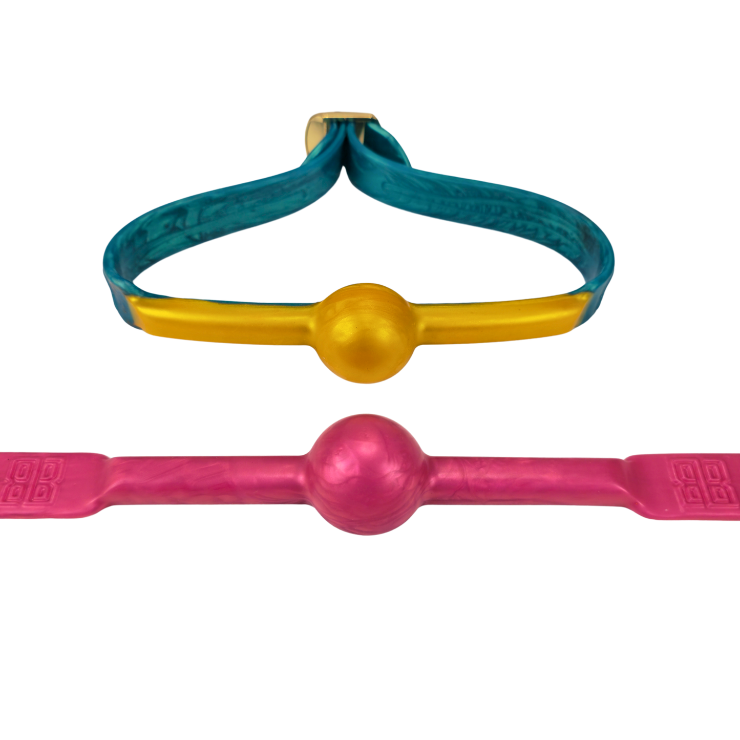 Two ball gags, one with a yellow ball on a blue strap and another with a pink ball on a pink strap, both laid out on a white background.