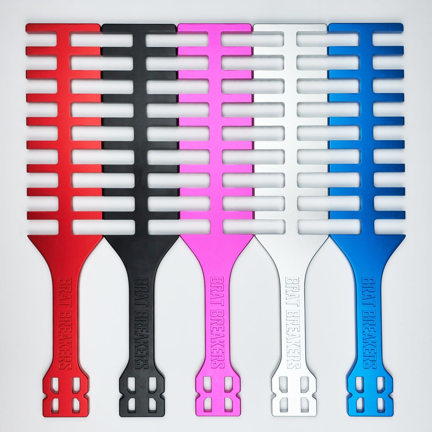 Collection of Spanking Paddles made by Brat Breakers in five different colours