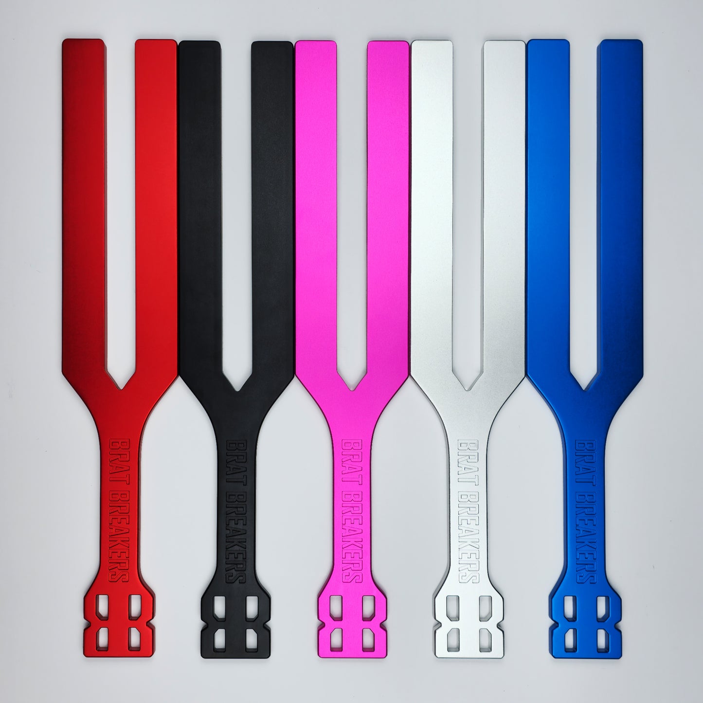 Collection of Spanking Paddles made by Brat Breakers in five different colours