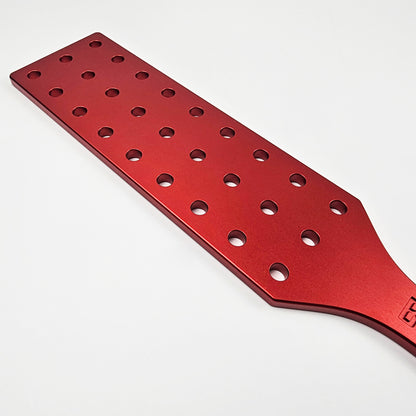 Red Steel Spanking Paddle with holes made by Brat Breakers